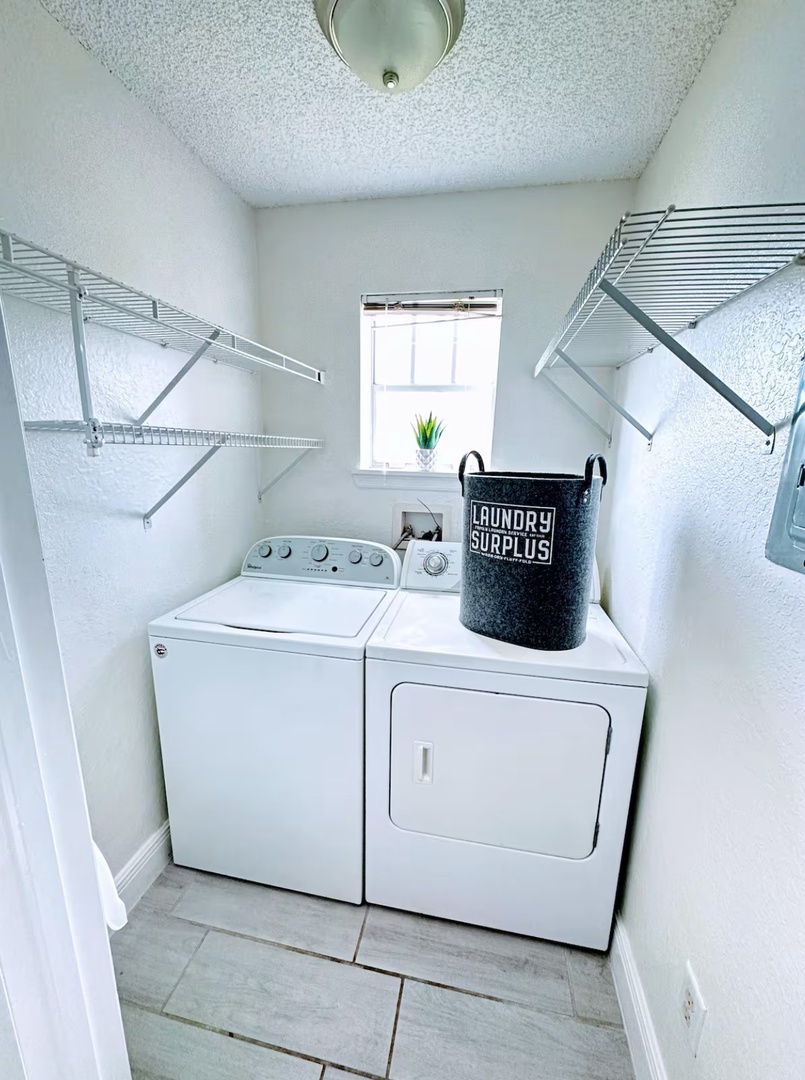 Private laundry is available for your stay, tucked away off living room