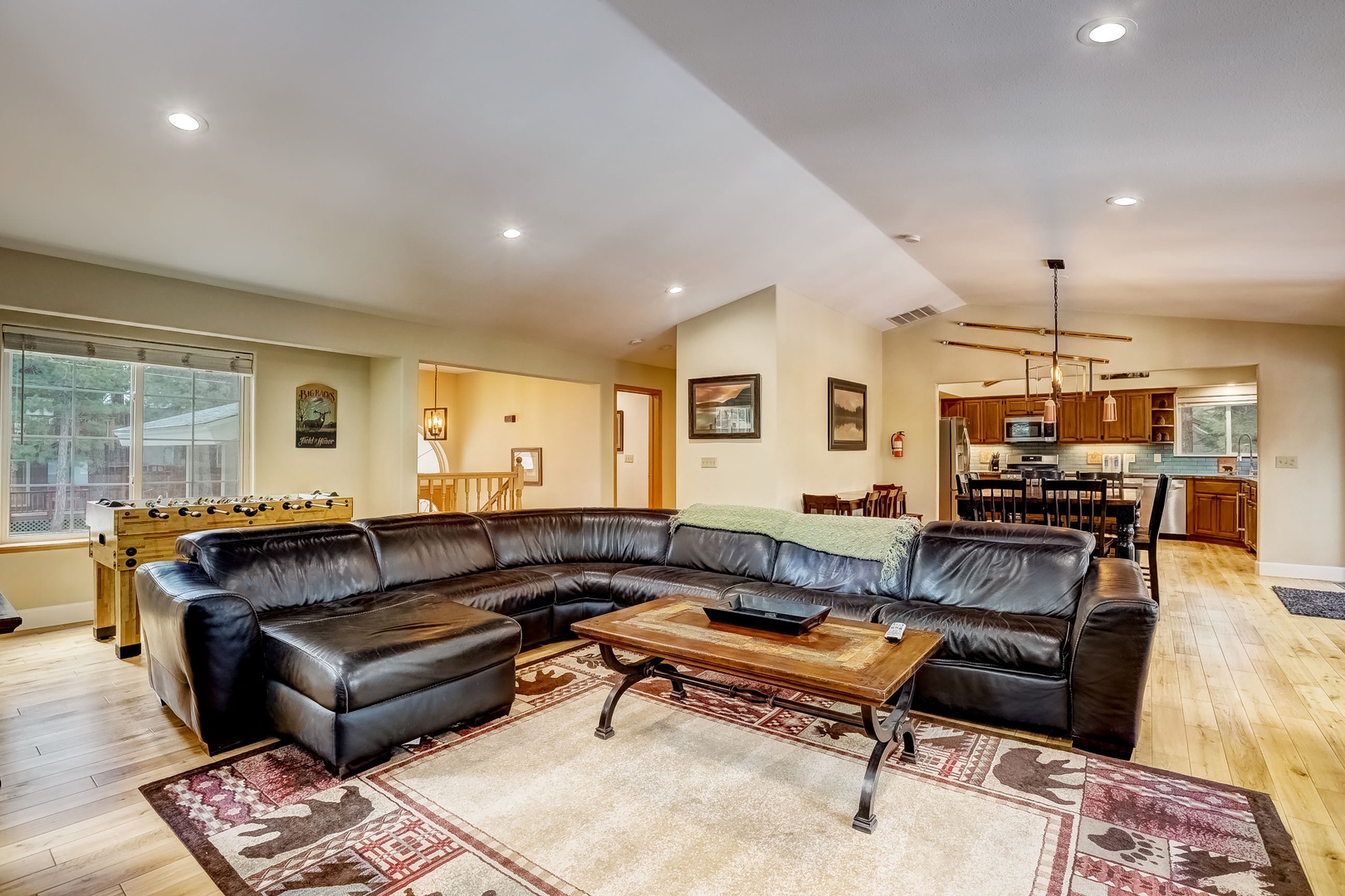 Living room w/ Smart TV, gas fireplace, foosball table