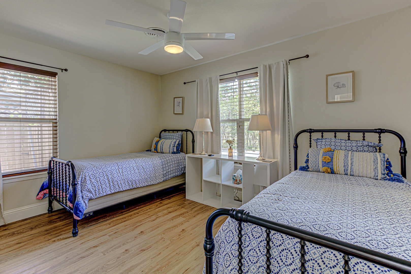 A pair of cozy twin beds awaits in the first bedroom retreat