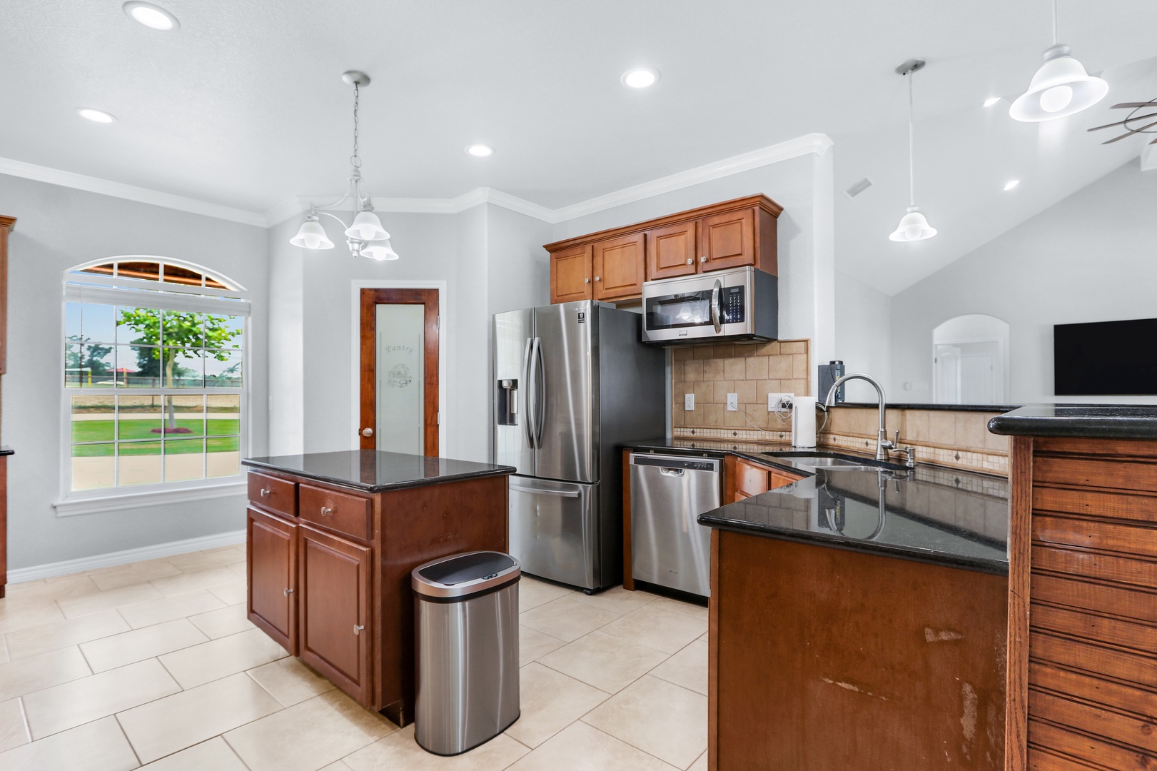 The warm, inviting kitchen offers ample space & all the comforts of home