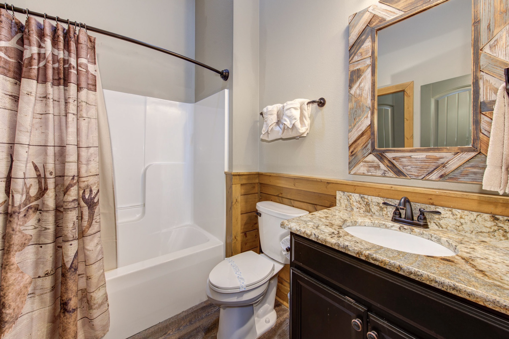 The third 1st floor ensuite features a single vanity & shower/tub combo
