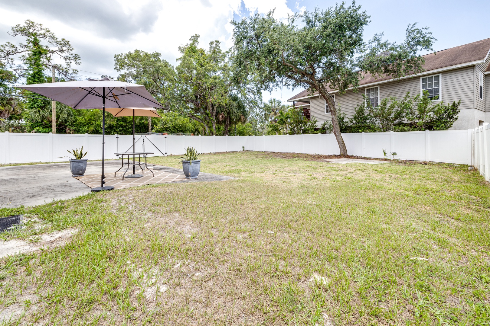 The fenced back yard offers loads of space for relaxation & play!