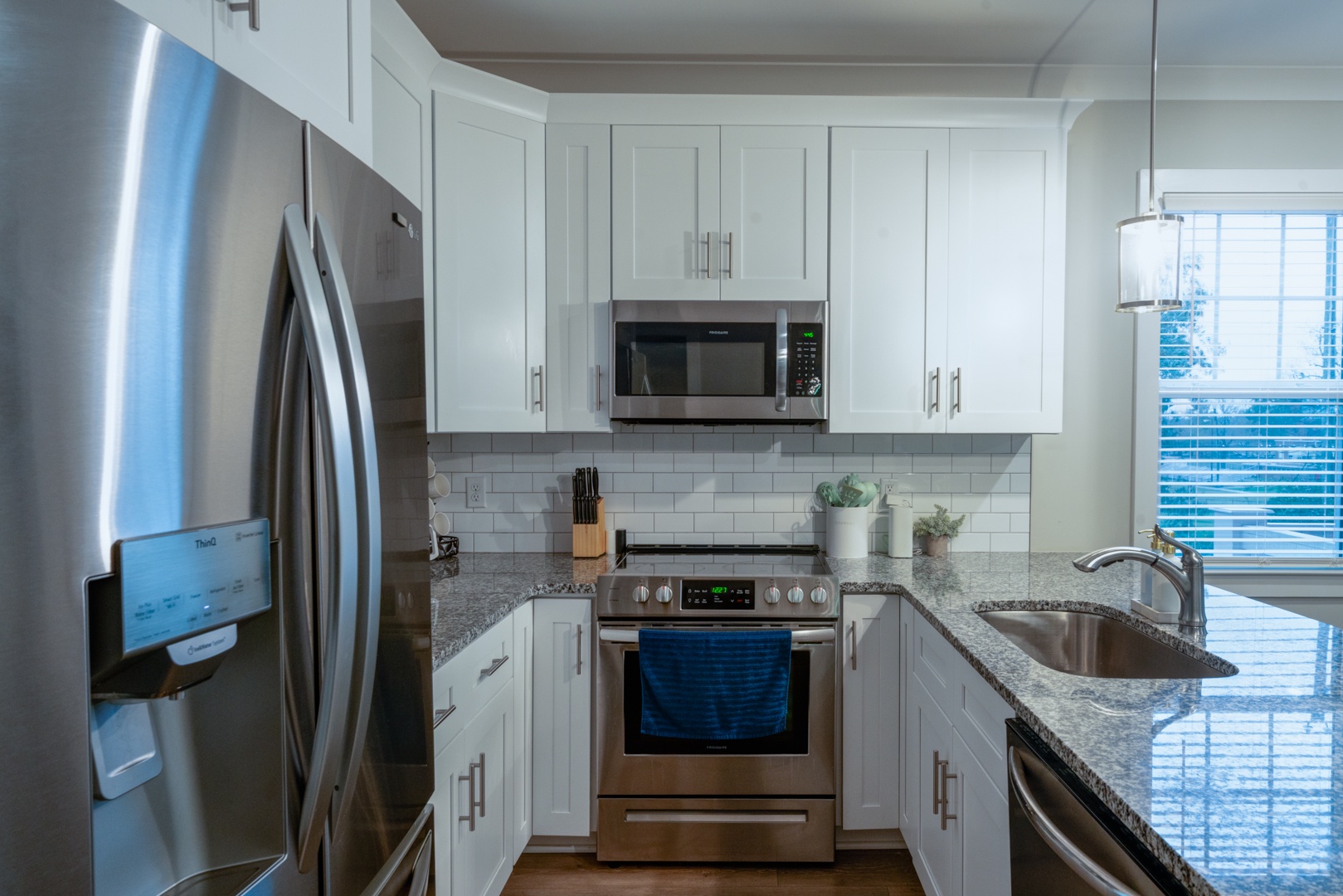 The open, airy kitchen offers ample space & all the comforts of home