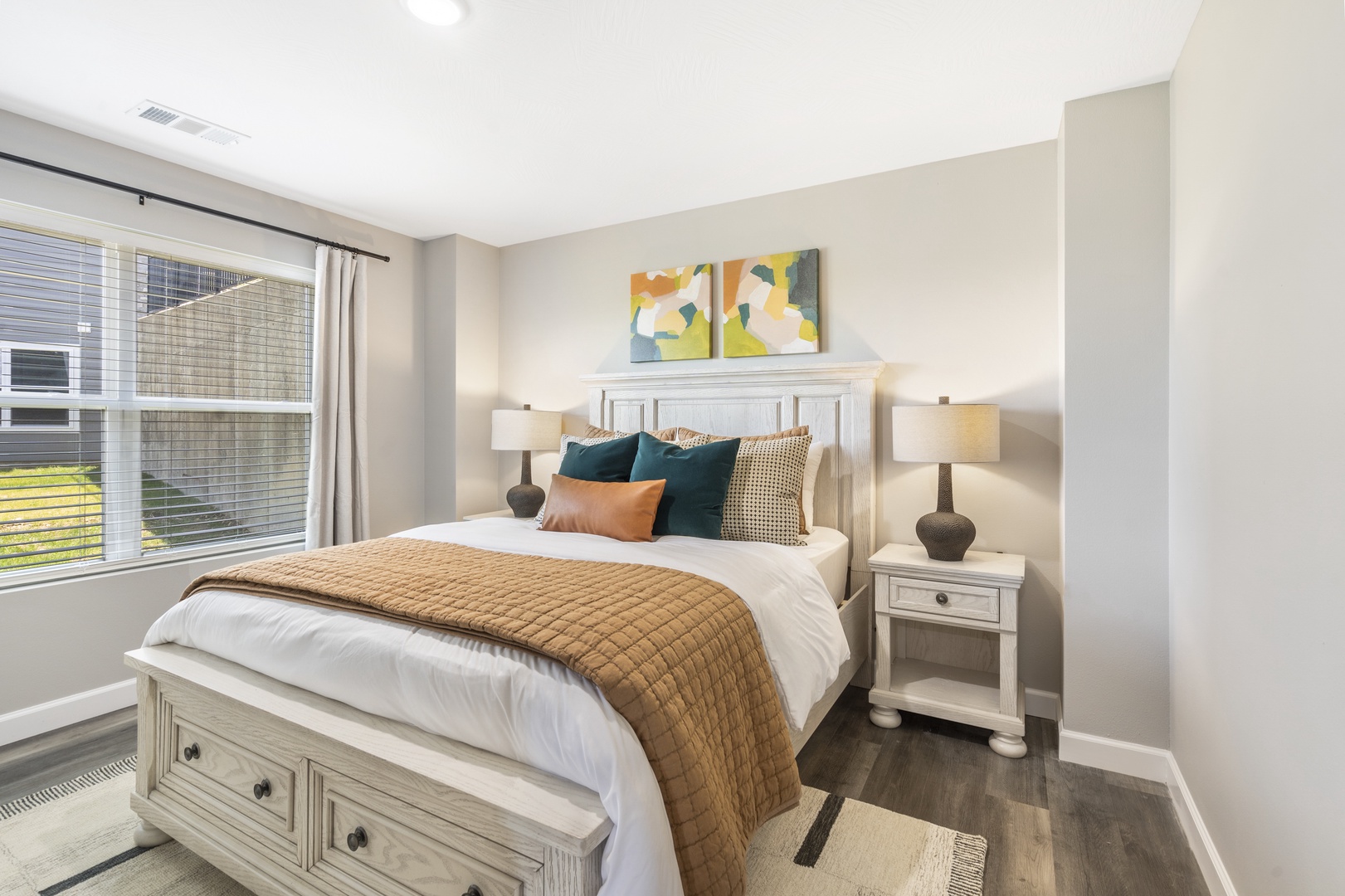 Relax in the final tranquil bedroom, complete with queen bed & smart TV