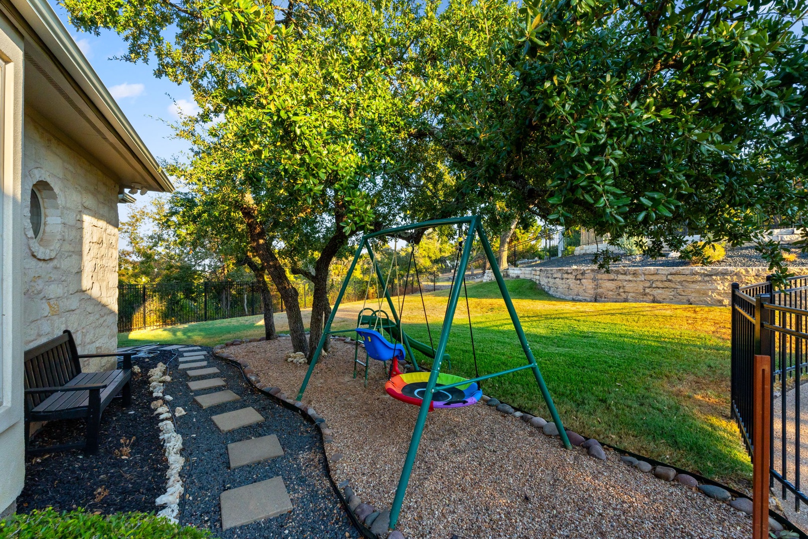 The yard offers ample space for relaxation & play for the whole family
