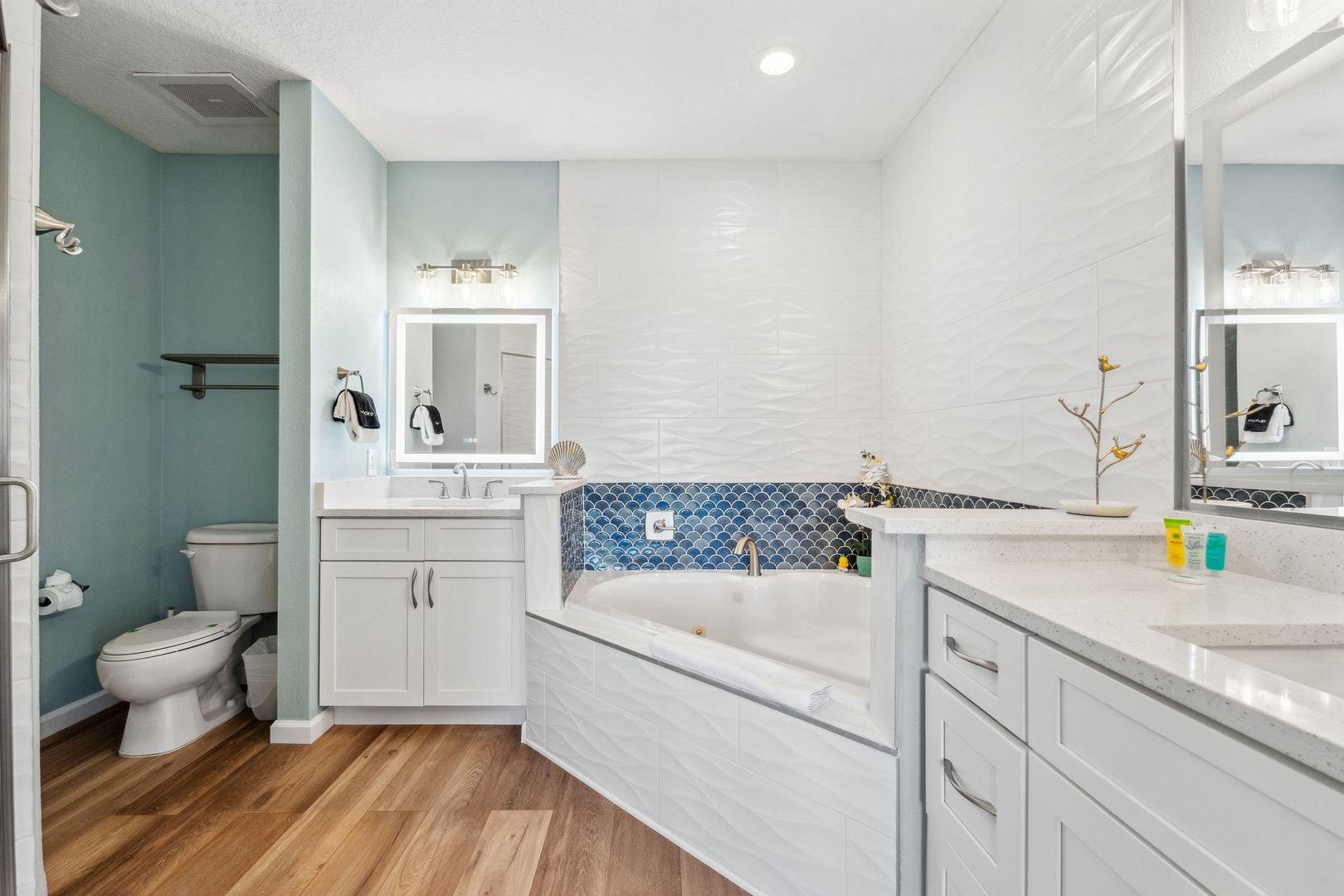 A pair of vanities, shower, & luxurious soaking tub awaits in the king ensuite