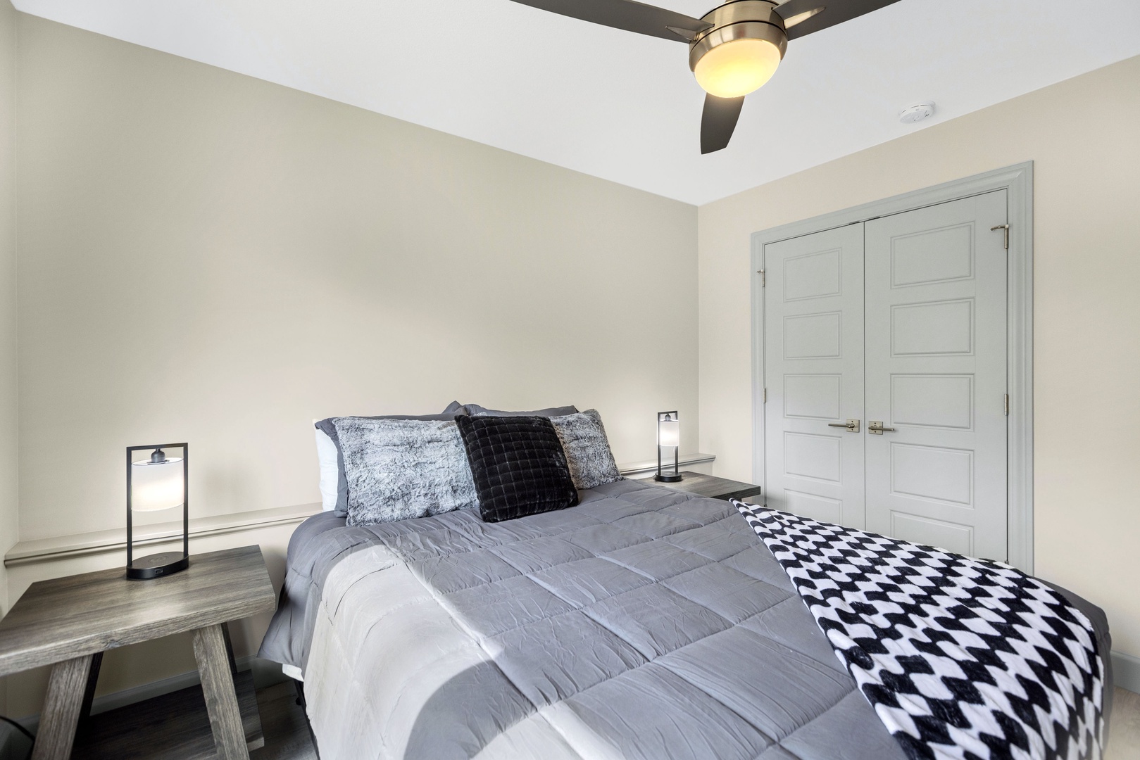 Relax in the second bedroom adorning a queen bed & nature views