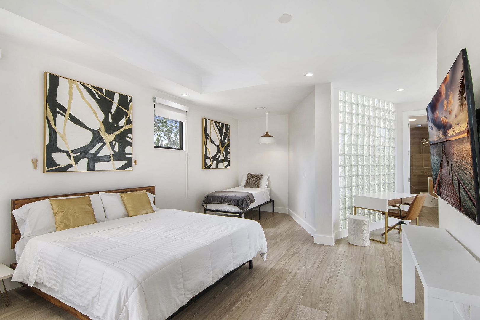 The 3rd floor suite boasts a king bed, twin pull-out, ensuite, balcony, & Smart TV