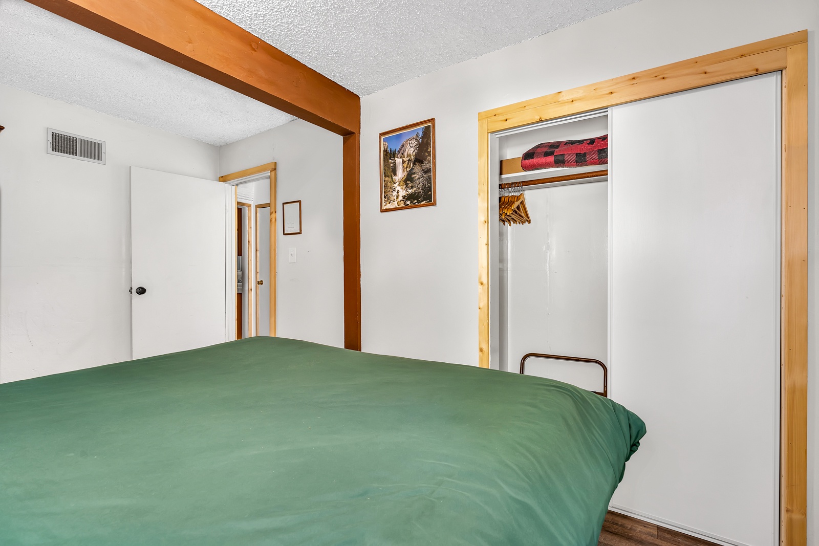 The first of three spacious bedrooms offers a plush king-sized bed
