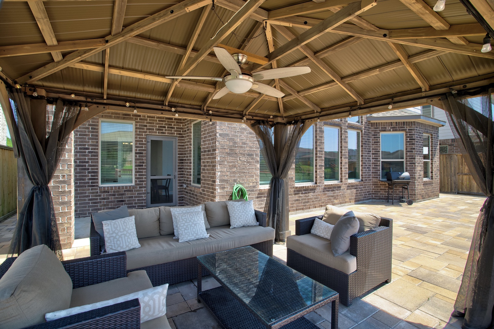 Back patio with covered outdoor seating