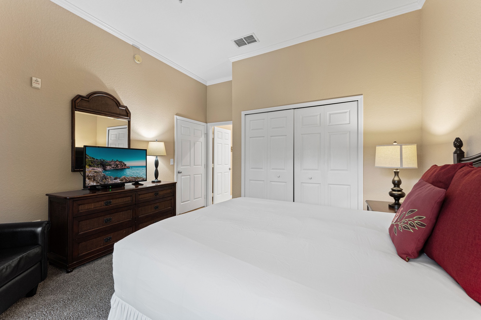 Recharge in the queen suite, featuring a TV, Jack & Jill ensuite, & balcony