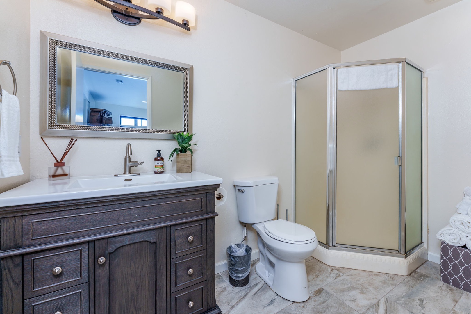 The Lower-Level shared Bathroom offers a Single Vanity and Standalone Shower
