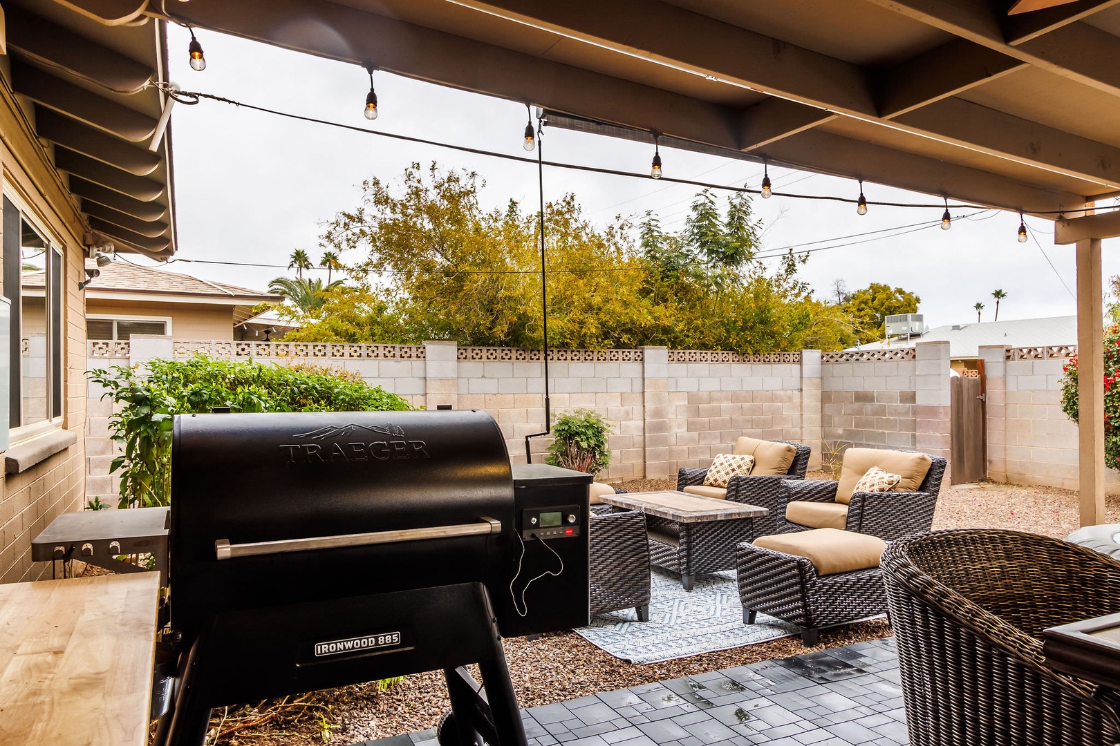 Patio with outdoor dining and gas BBQ grill