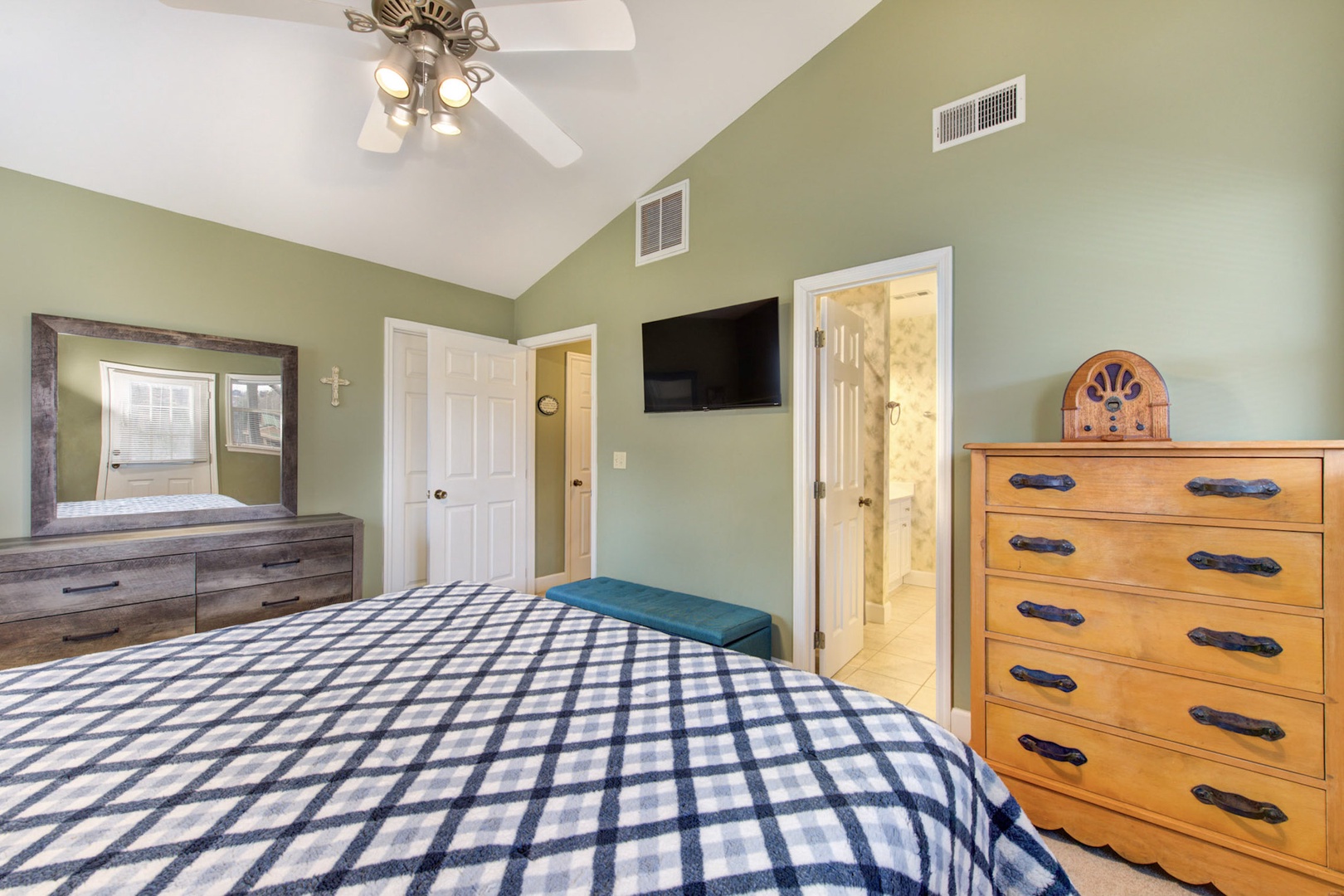 This 2nd floor king suite offers a private ensuite, balcony access, & Smart TV