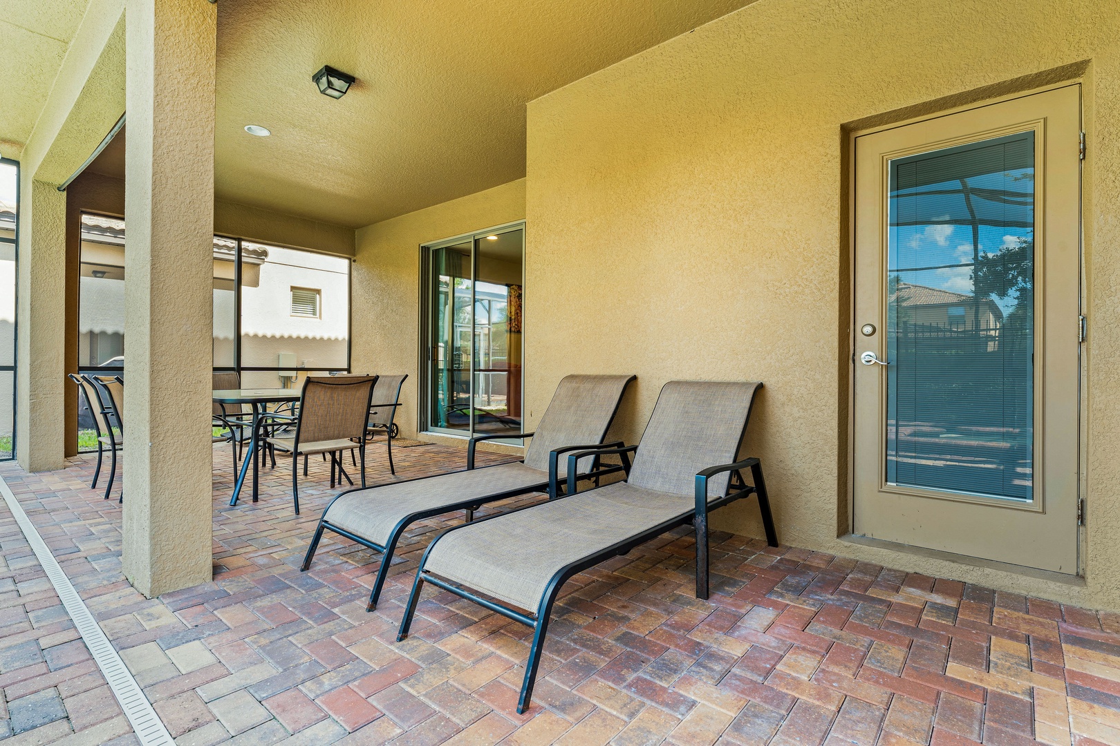 Screened in pool with outdoor seating