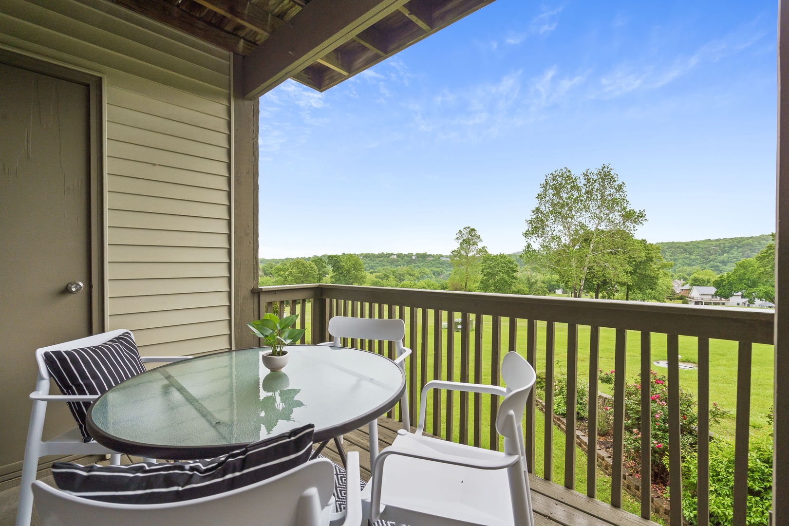 Balcony with outdoor seating and golf course view