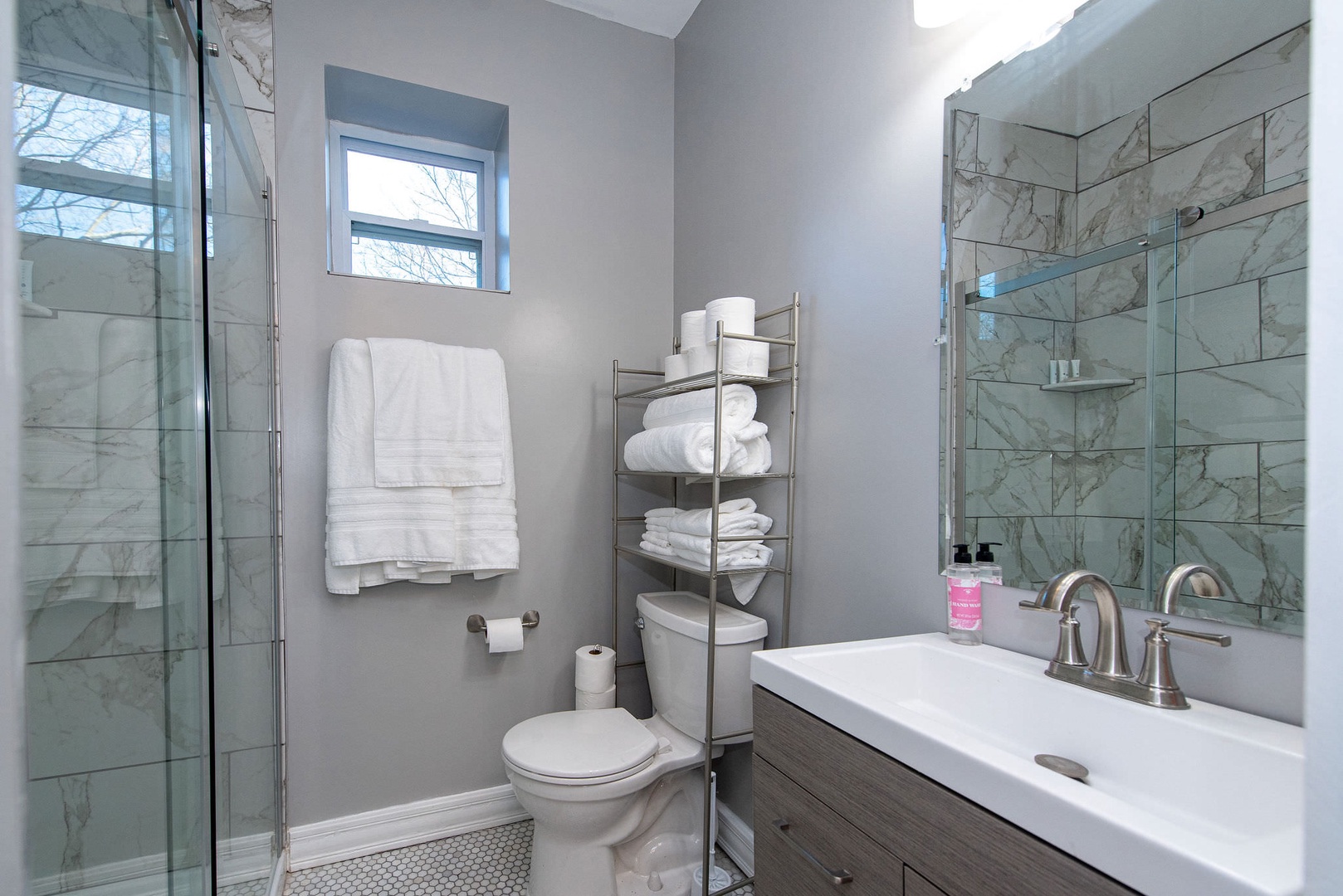 Suite 2 – The 2nd floor full bath includes a single vanity & glass shower