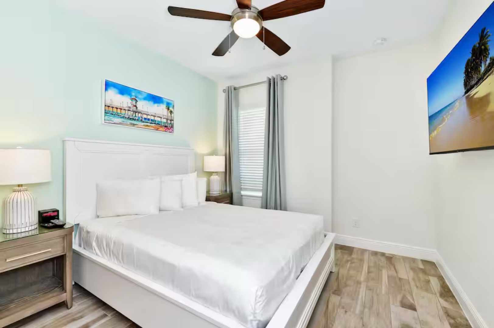 The final 2nd-floor queen bedroom, smart TV & ceiling fan