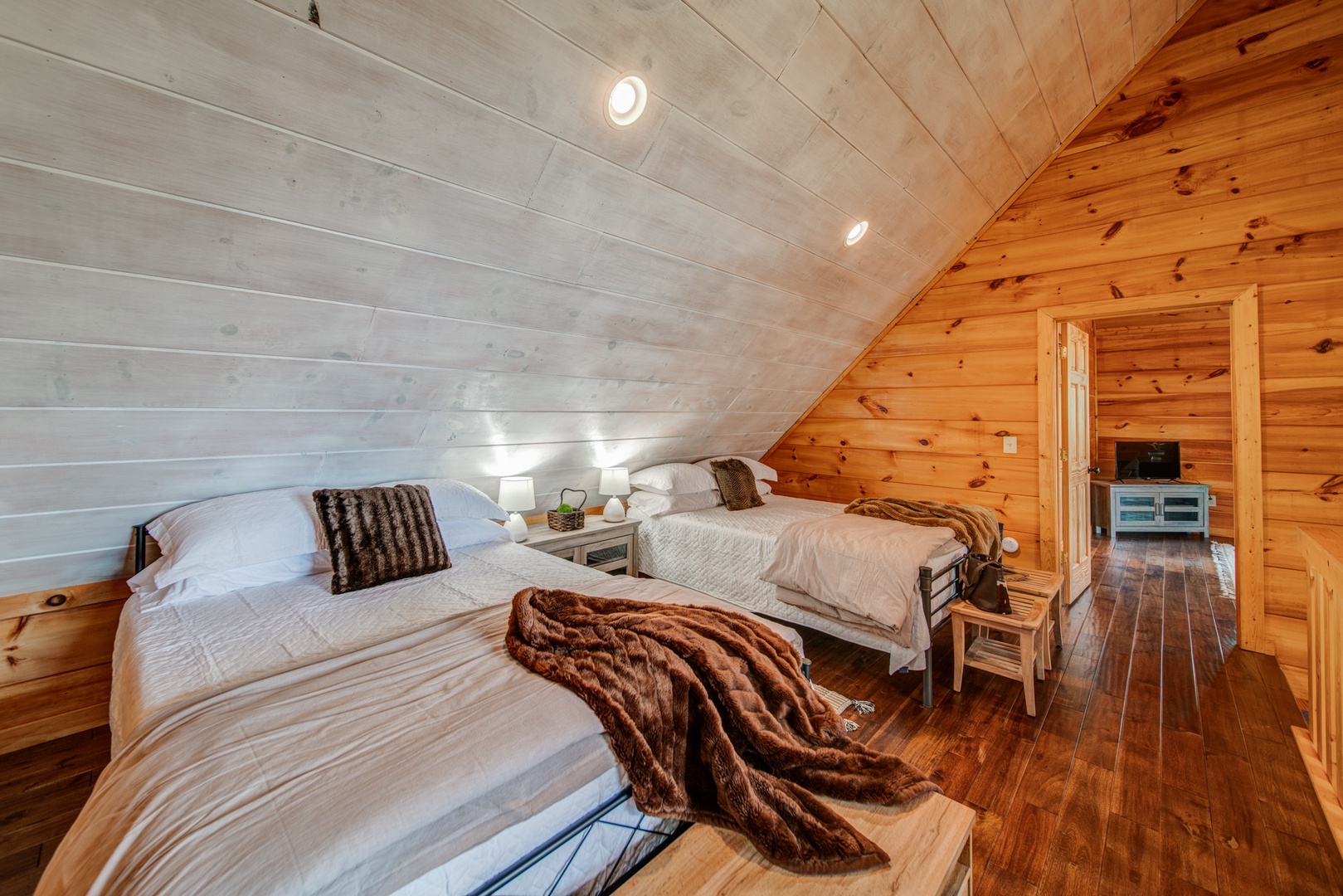 The second-level loft offers a pair of comfy queen beds