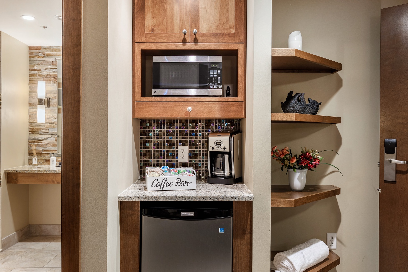 Kitchenette with coffee maker, microwave and fridge