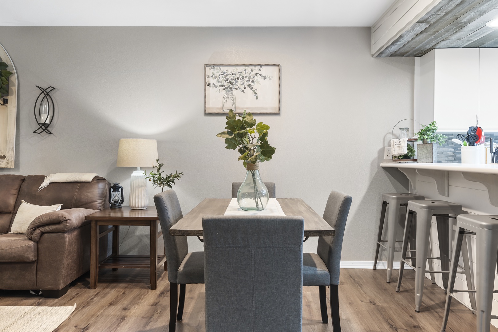 Gather for meals together at the dining table, offering seating for 4