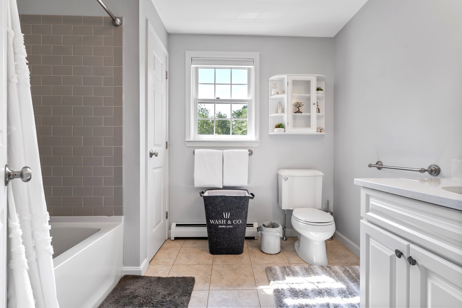 The shared 2nd floor full bath includes a single vanity & shower/tub combo