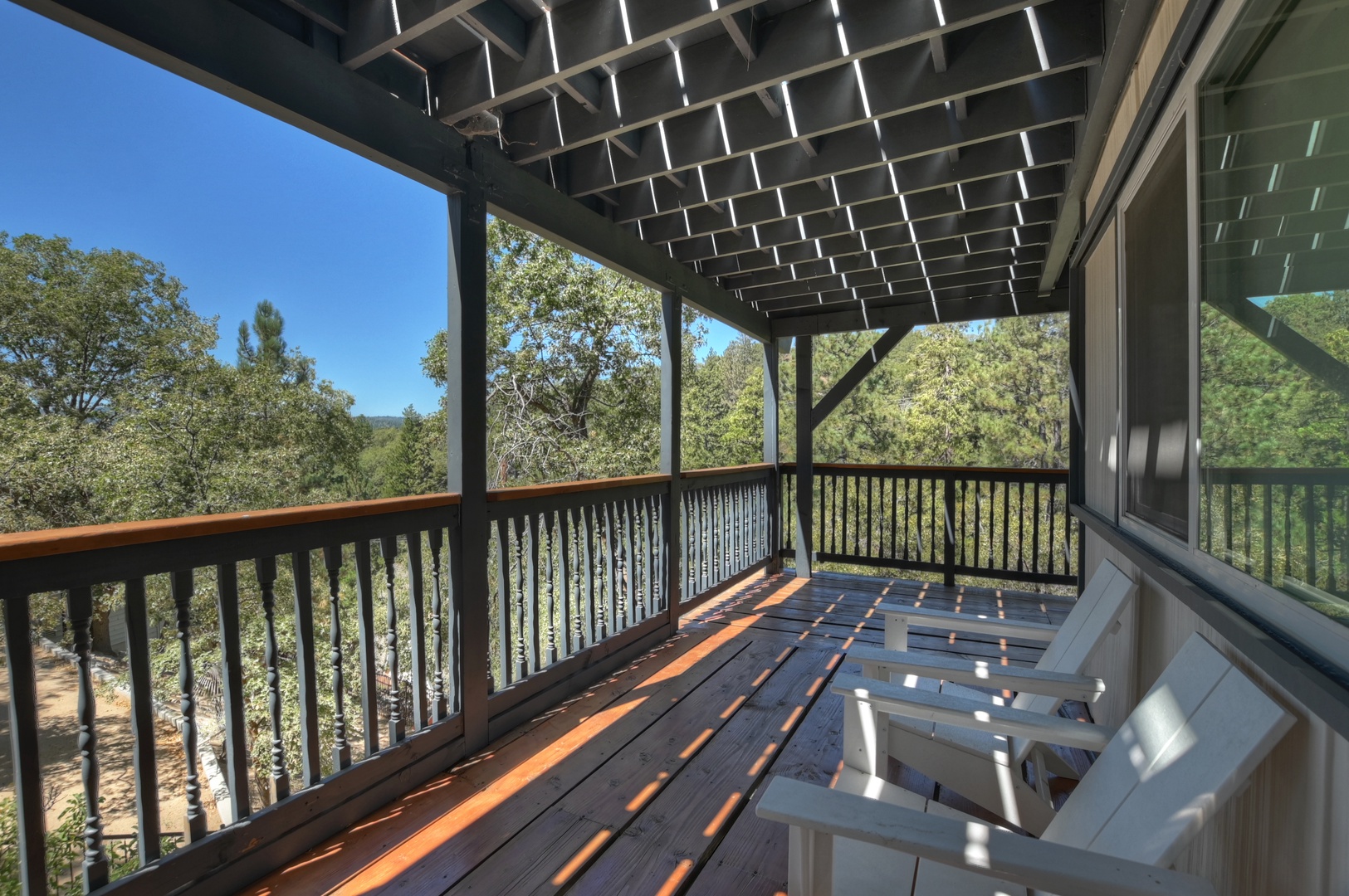 Deck with hot tub, seating, and hammock