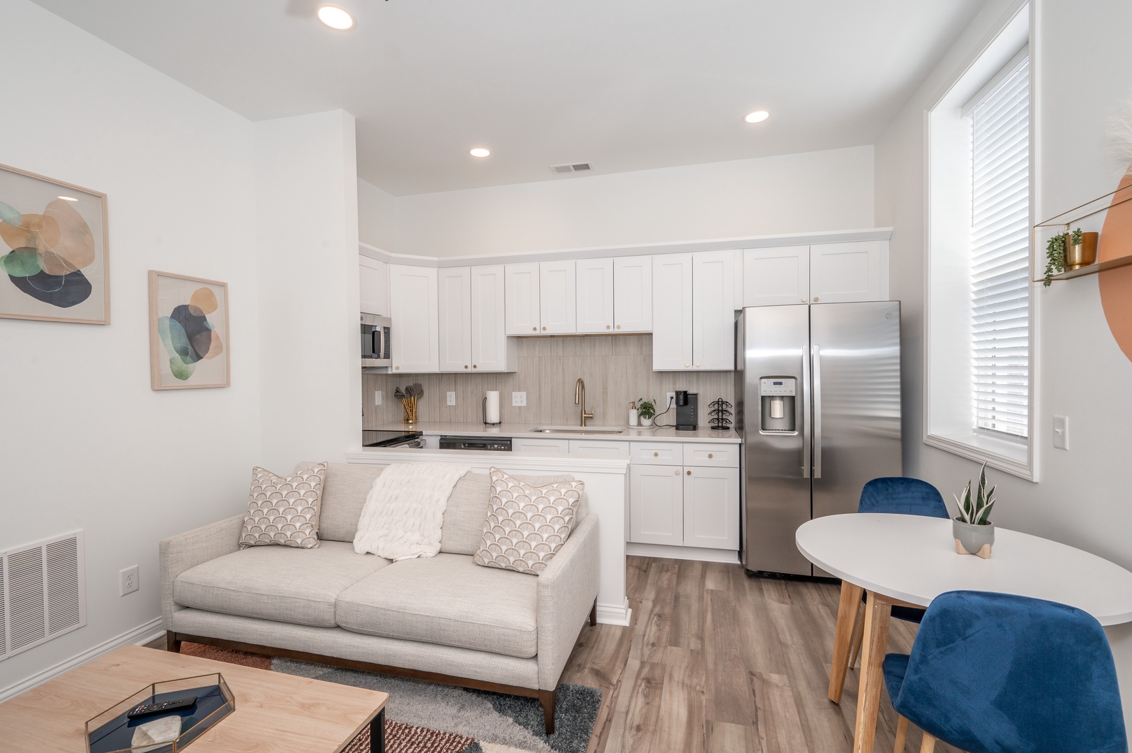 Unit 202: Enjoy the open layout of the light-filled living/dining & kitchen areas