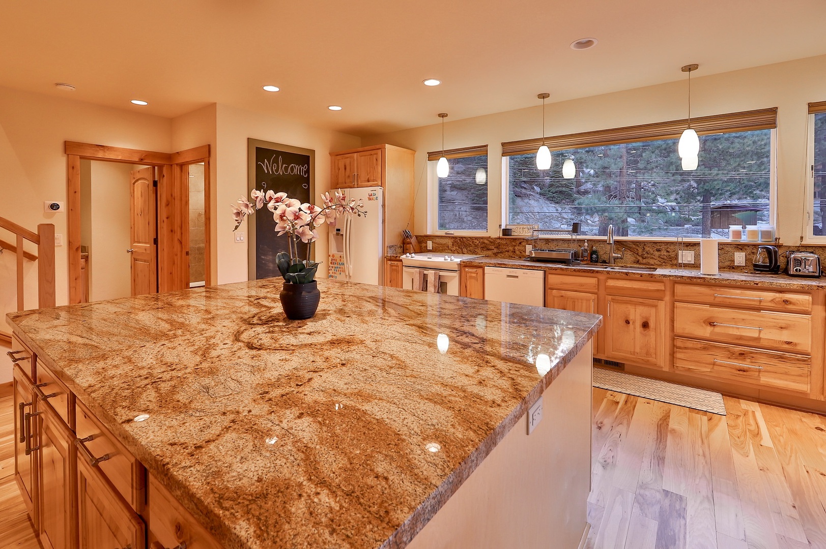 The open, airy kitchen offers ample space & all the comforts of home