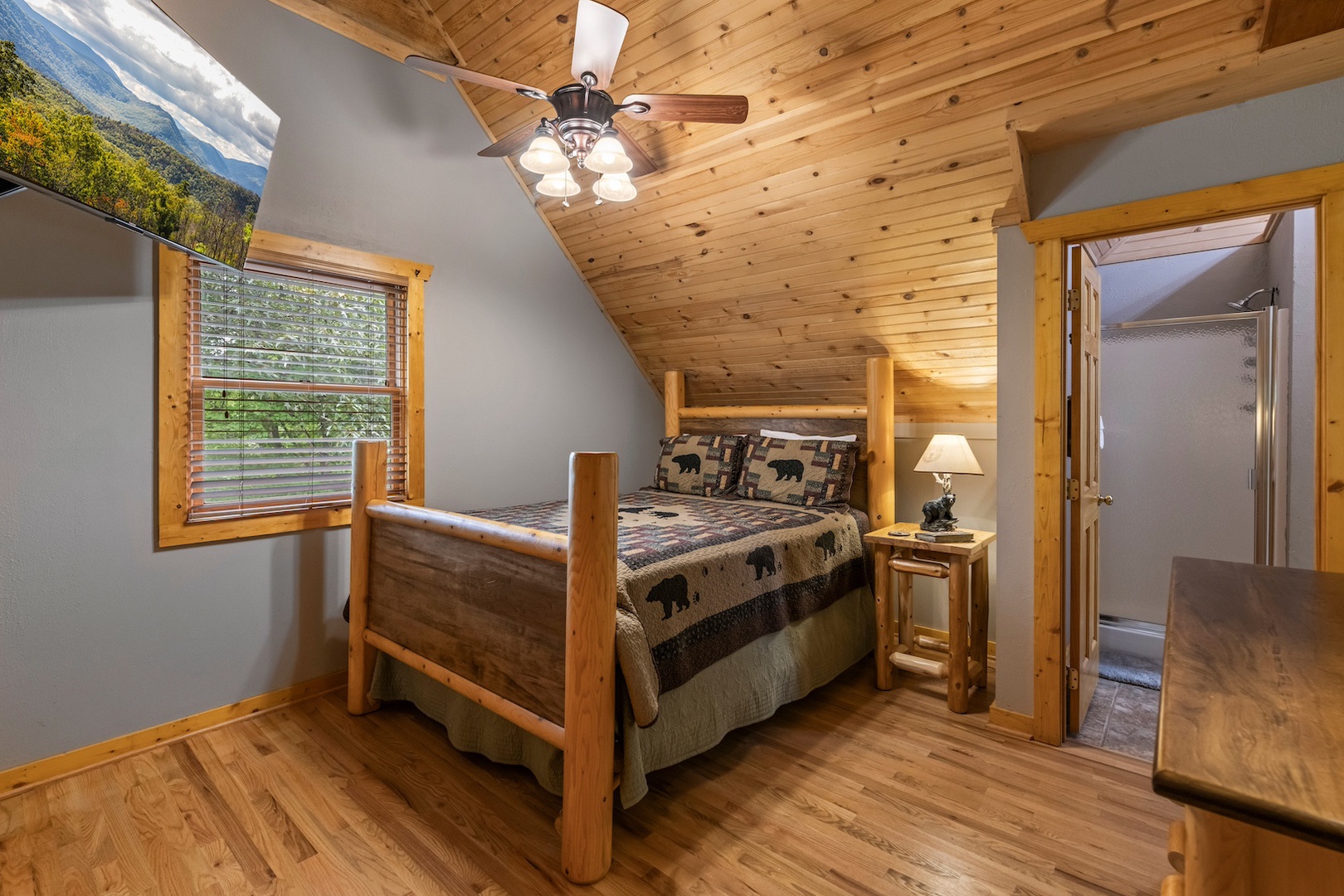 Bedroom 2 with queen bed, Smart TV, and shared ensuite