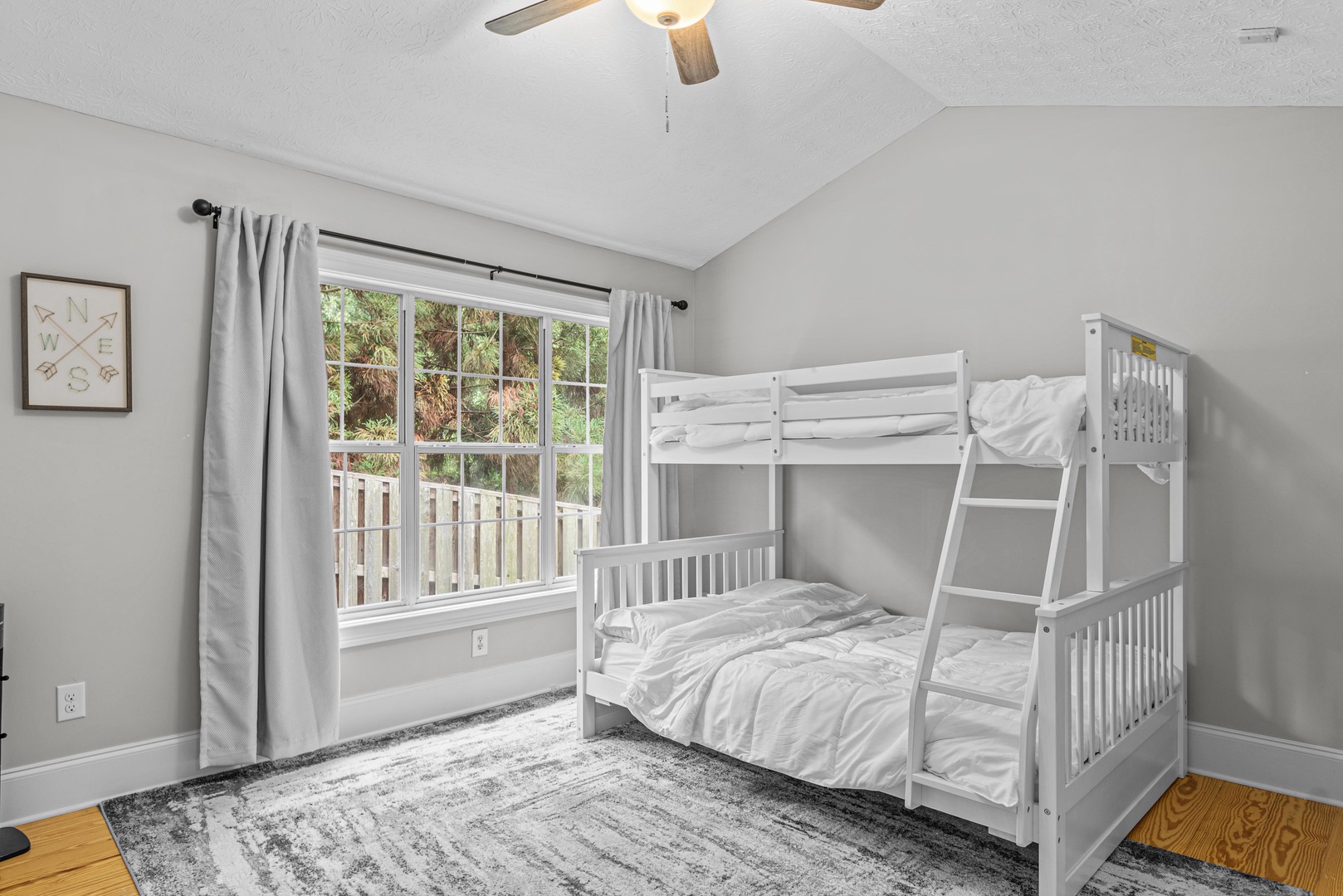 The second bedroom offers a twin-over-full bunkbed & ceiling fan