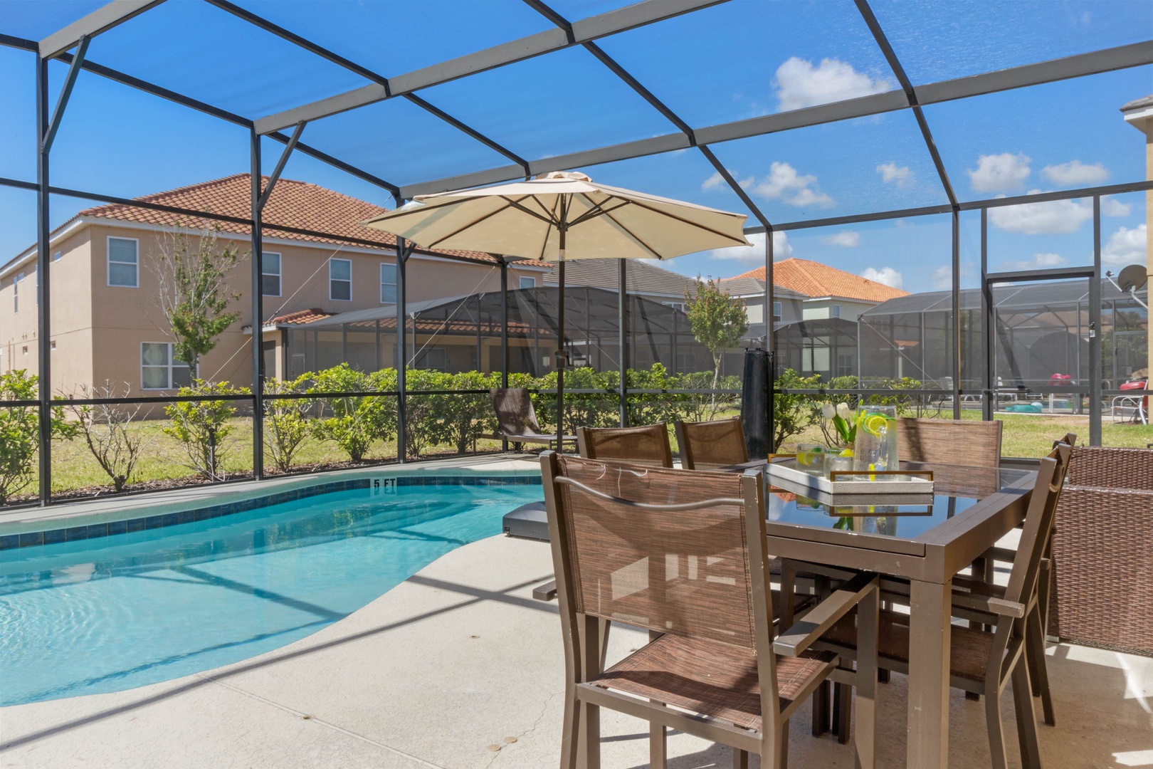 Private screened pool area with pool and outdoor seating