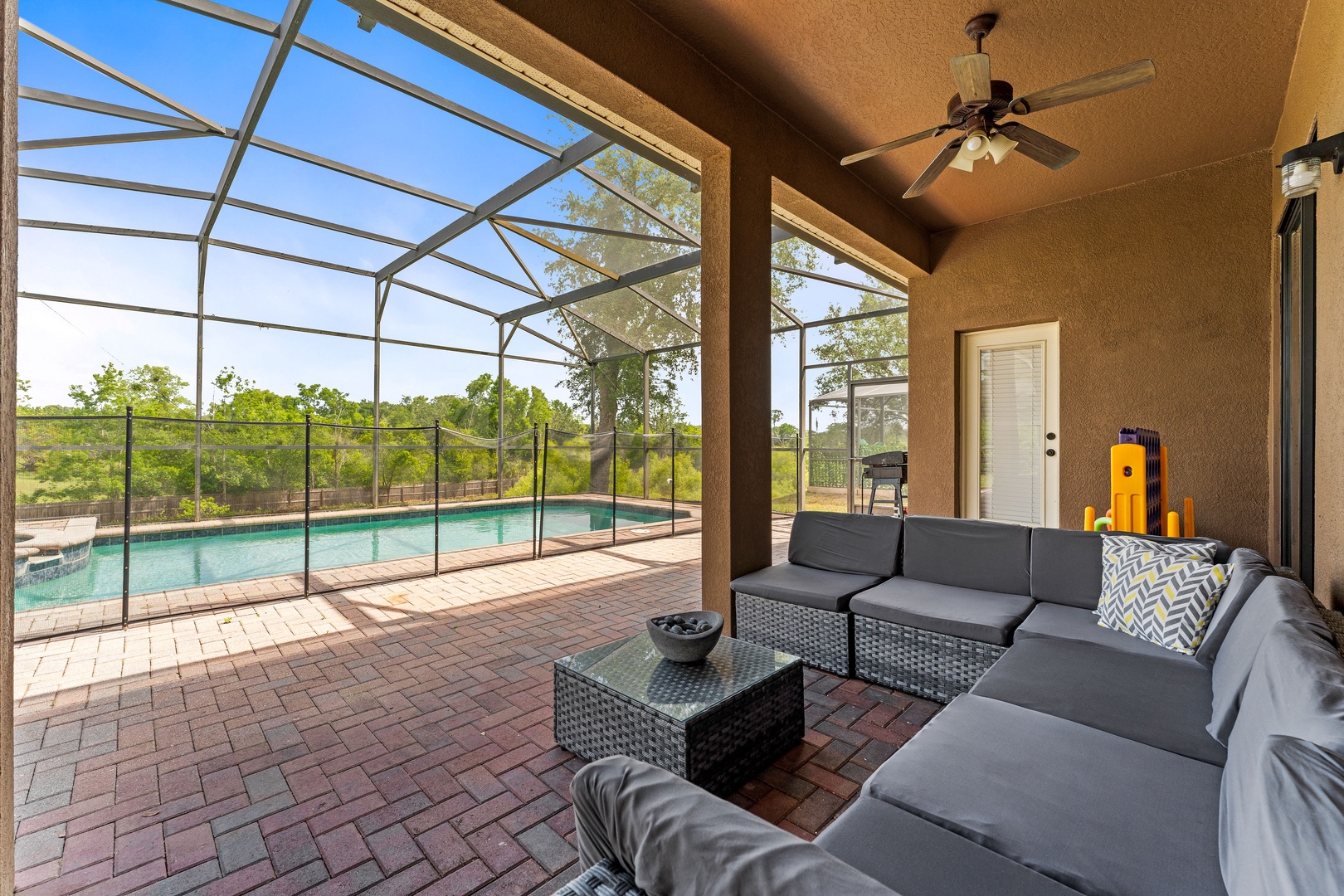 Private screened pool with outdoor seating, games & ceiling fans
