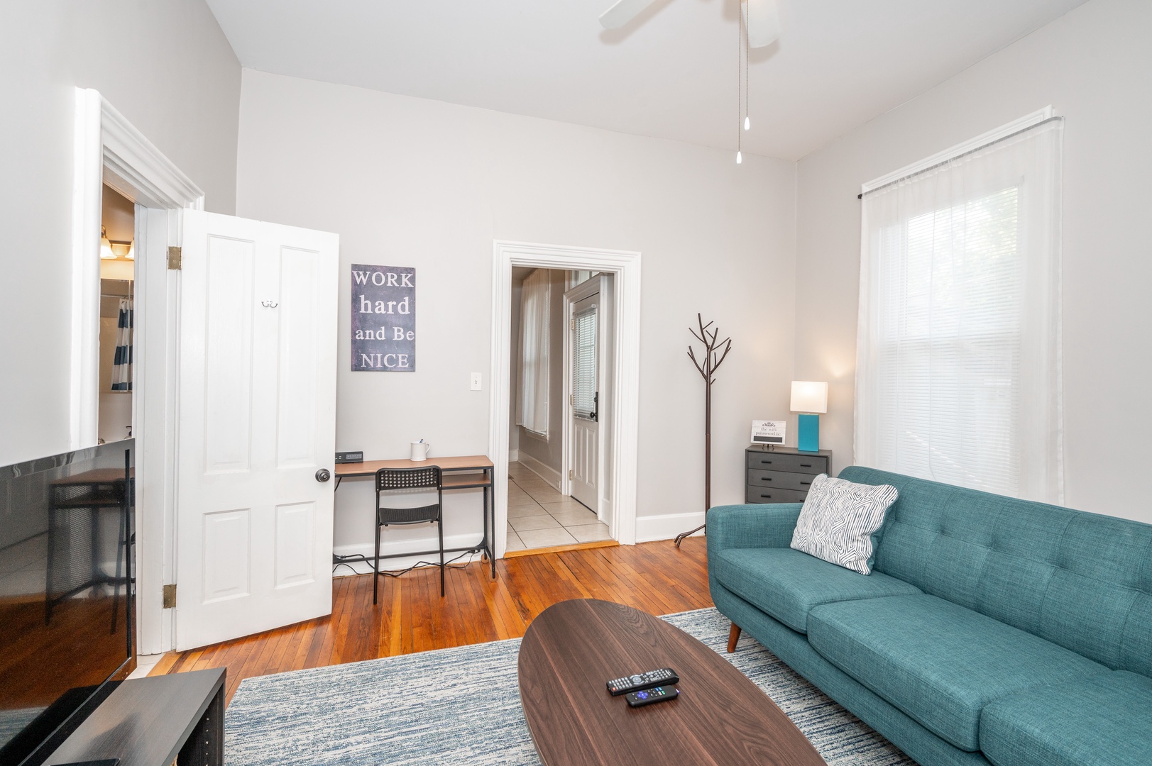 Cozy and spacious living area with TV