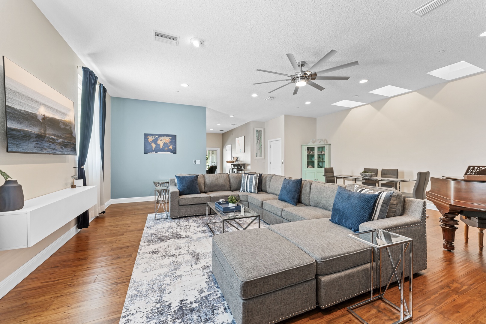 Living area with large sectional and Smart TV