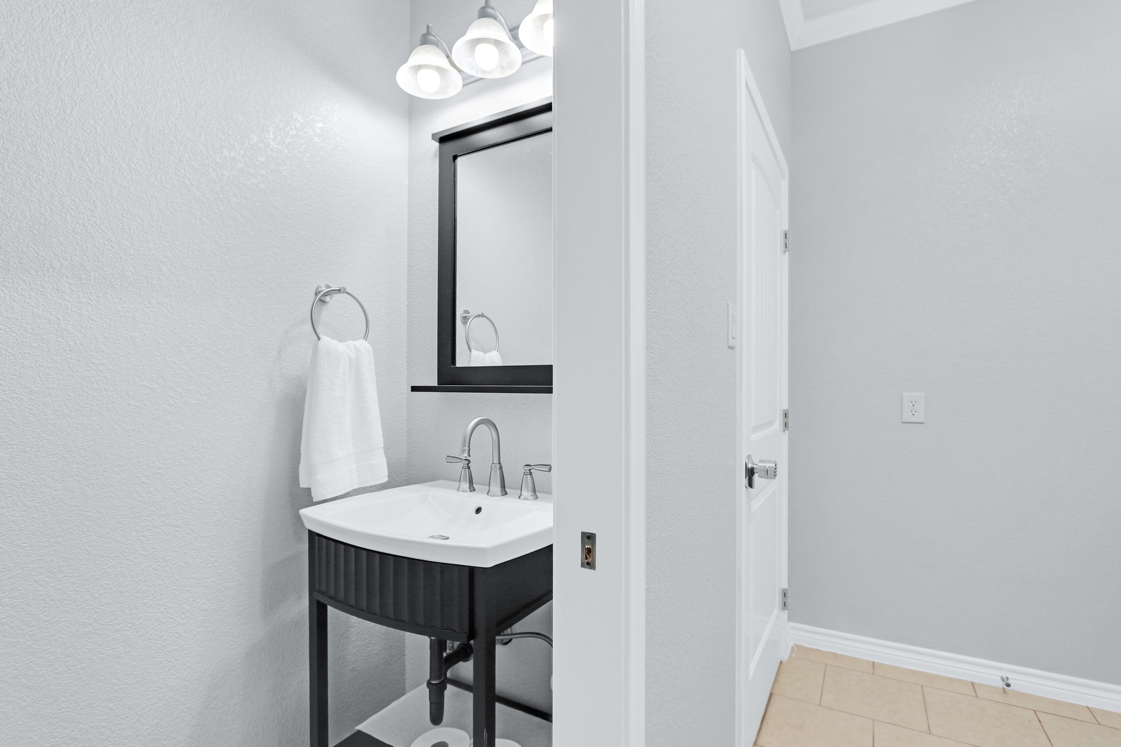 The garage mudroom features a convenient powder room