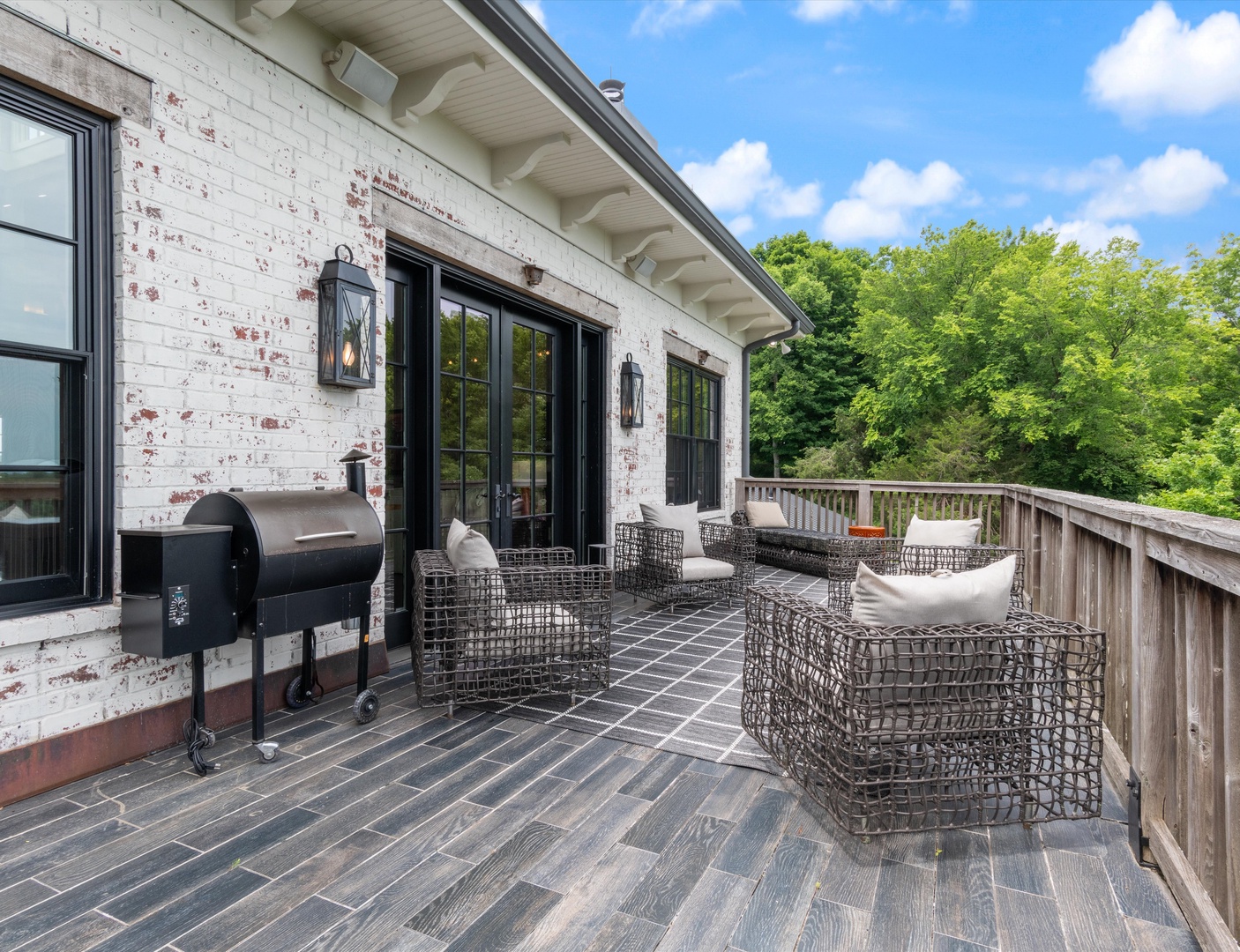 Balcony with outdoor seating and grill