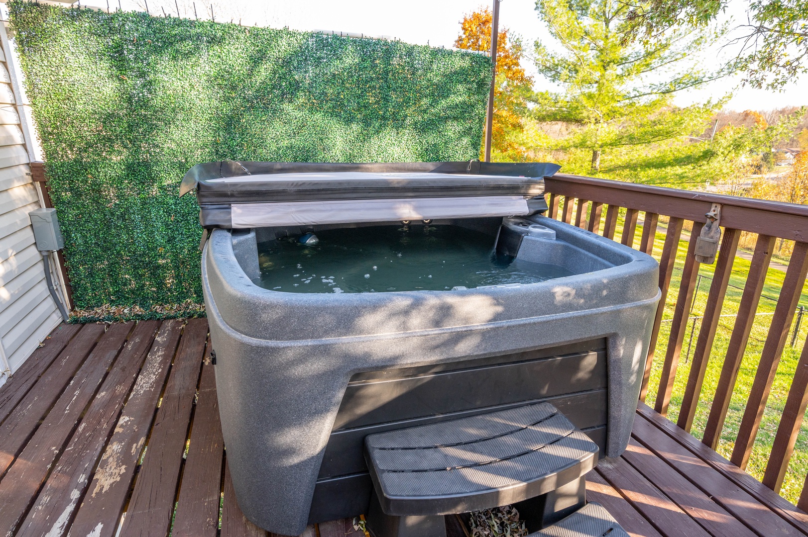 Soak all your cares away in the private hot tub on the back deck