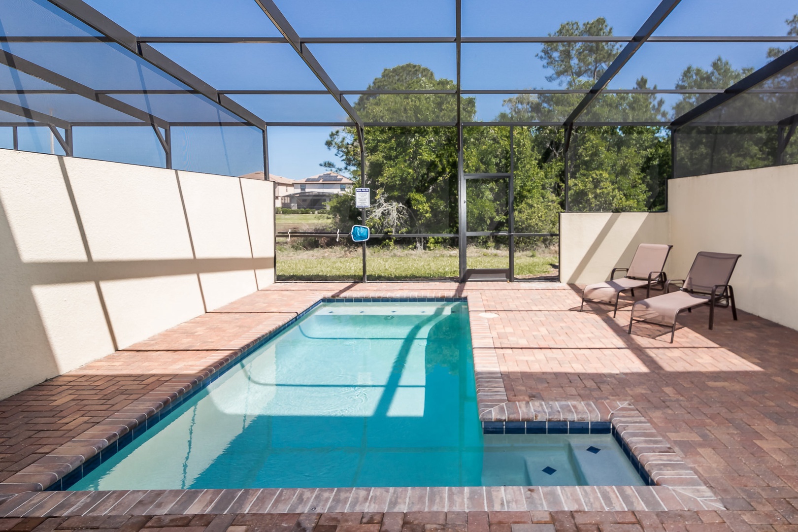 Gated pool with outdoor seating