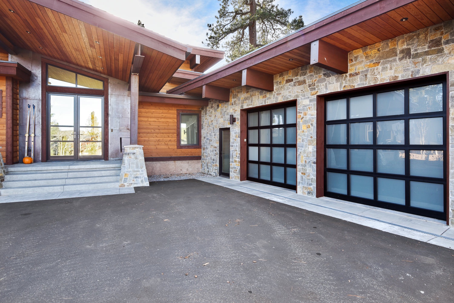 Front entry, driveway, and garage