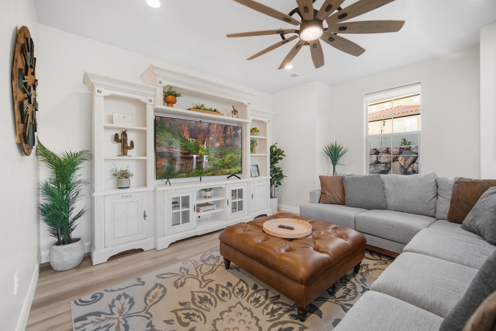 Bright living area with comfy seating and Smart TV