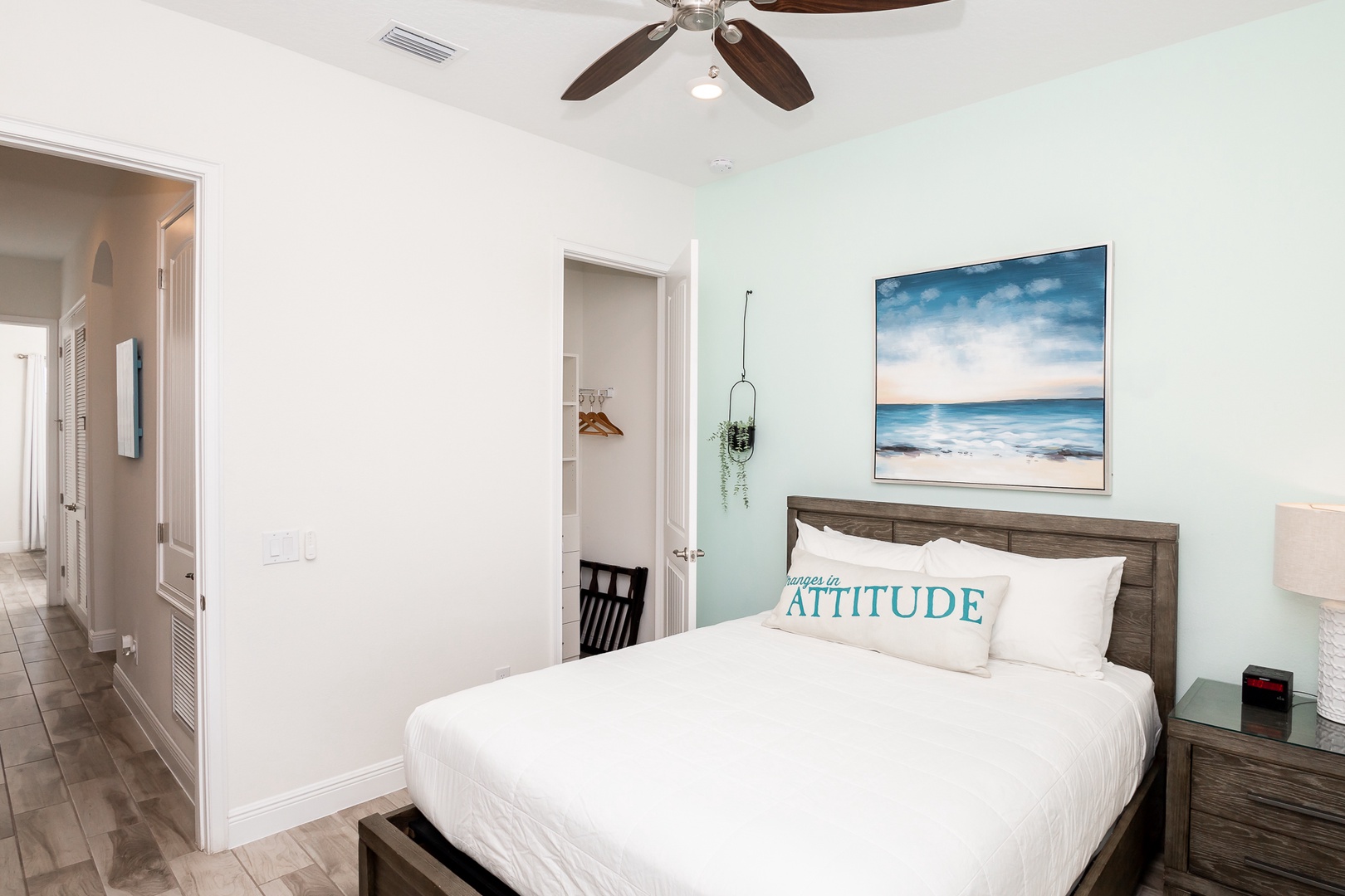 The beachy 2nd floor queen bedroom includes & Smart TV & organized closet