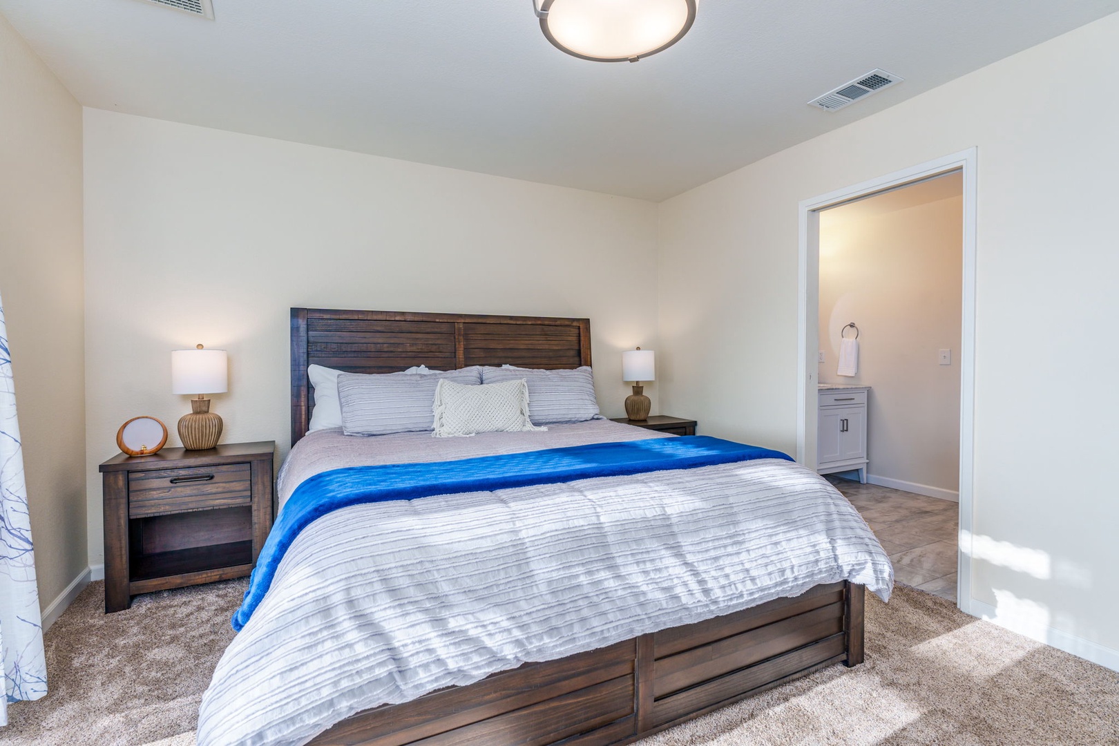 The Master Suite offers a King Bed, En Suite Bath, and access to the Back Deck