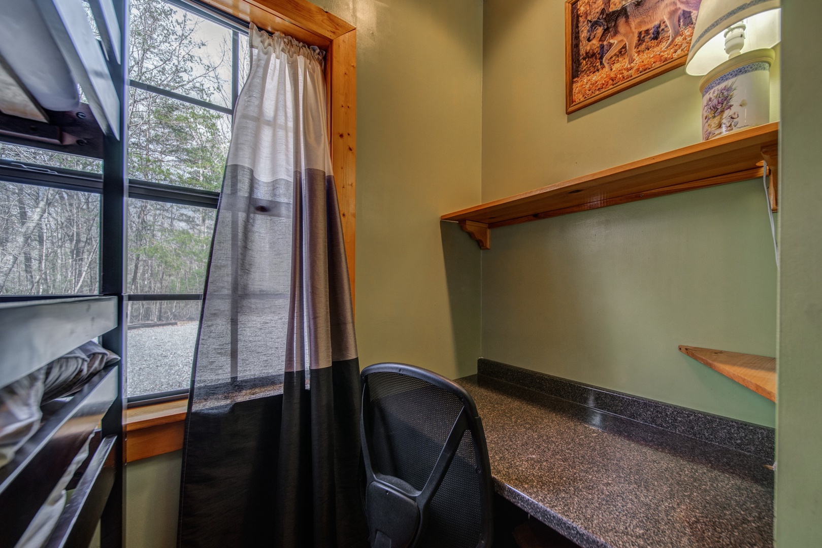 A convenient desk area is tucked away in the Bunk Room