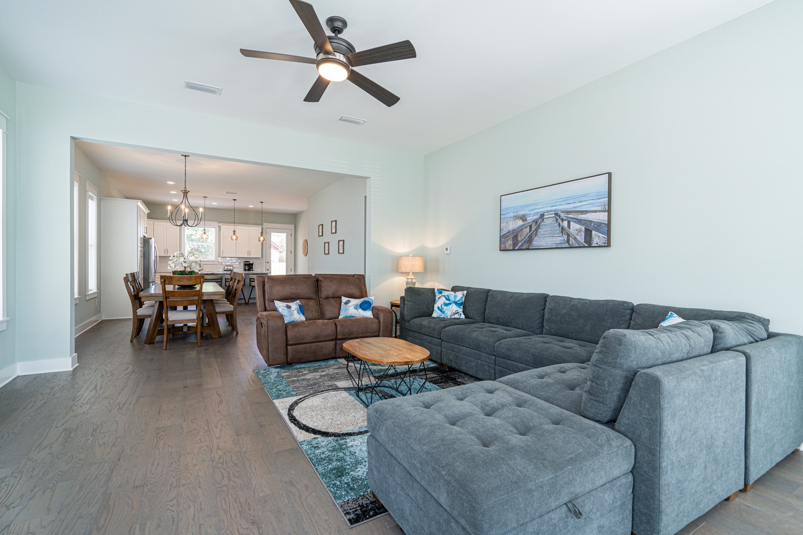 Open-concept living and dining area with a cozy sectional sofa