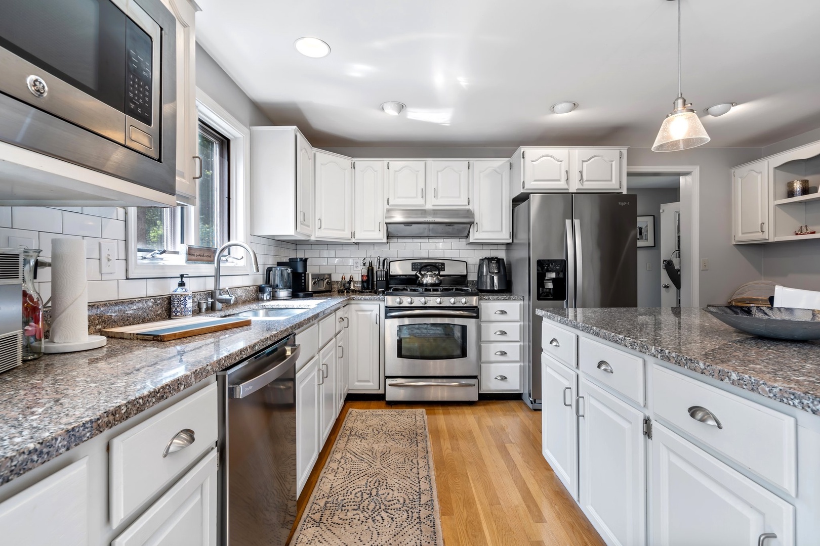 The open, airy kitchen offers ample space & all the comforts of home