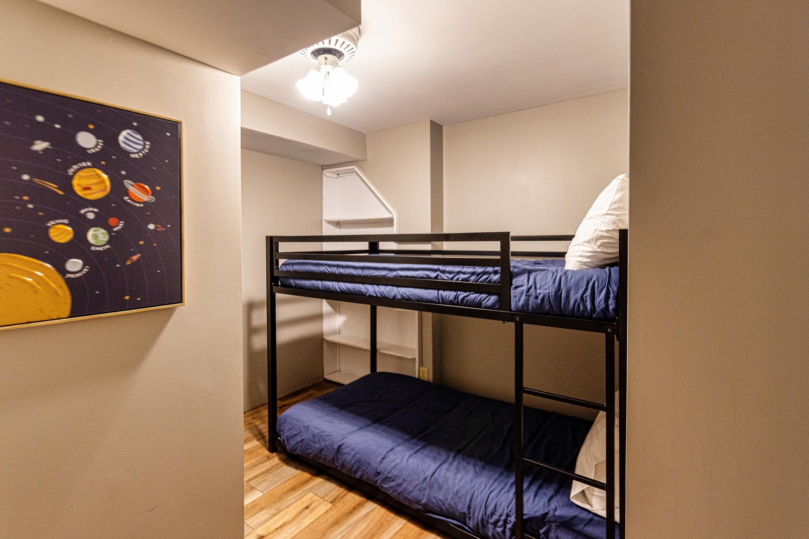 The final lower-level bedroom offers a cozy twin-over-twin bunkbed