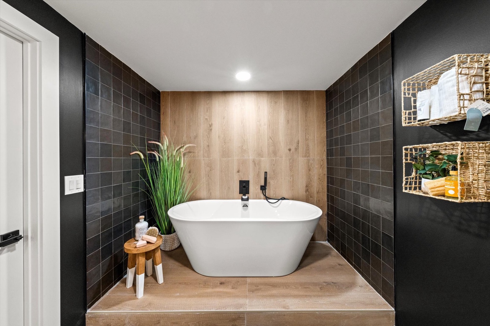 Unwind in the lower-level bathroom, boasting a luxurious soaking tub