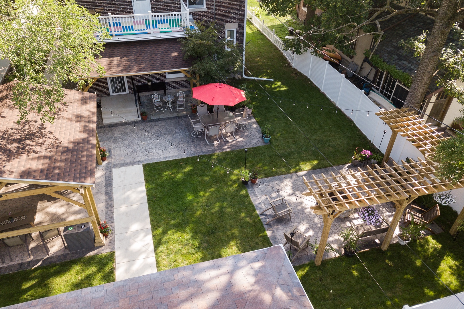 The large back yard offers tons of space for relaxation, dining, & play