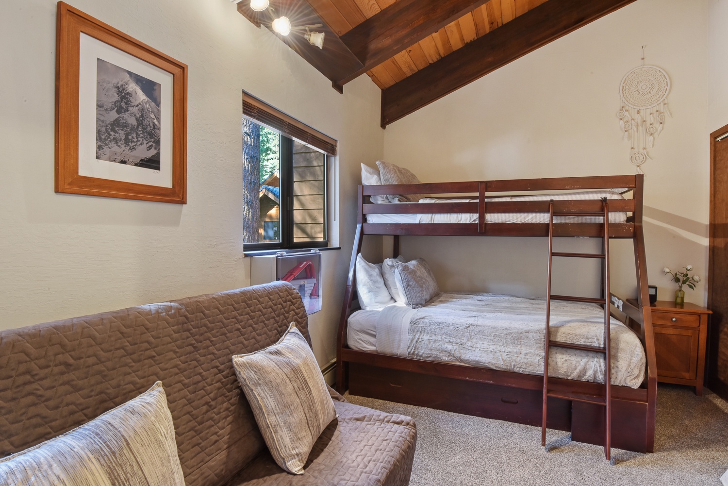 The 3rd level back bedroom offers a twin-over-full bunkbed & a full-sized futon